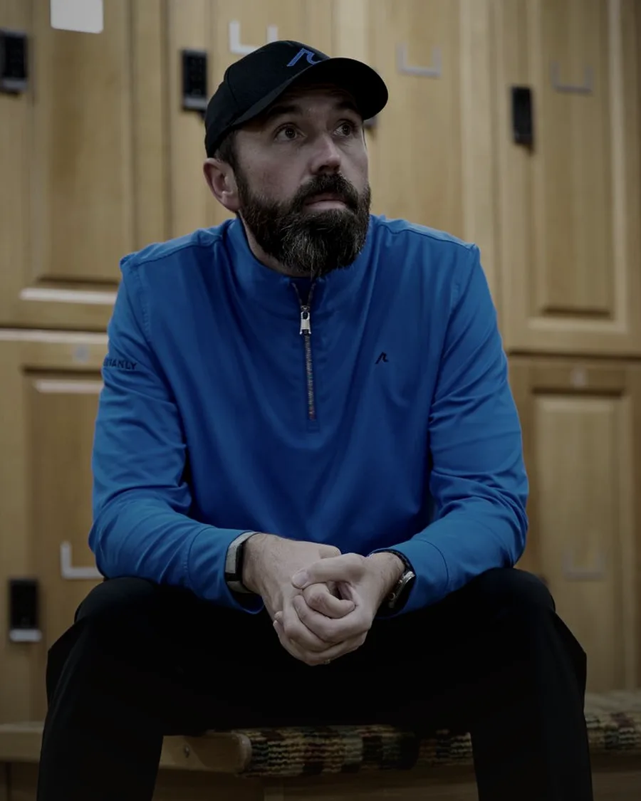 Rick Shiels sitting in a golf club locker room